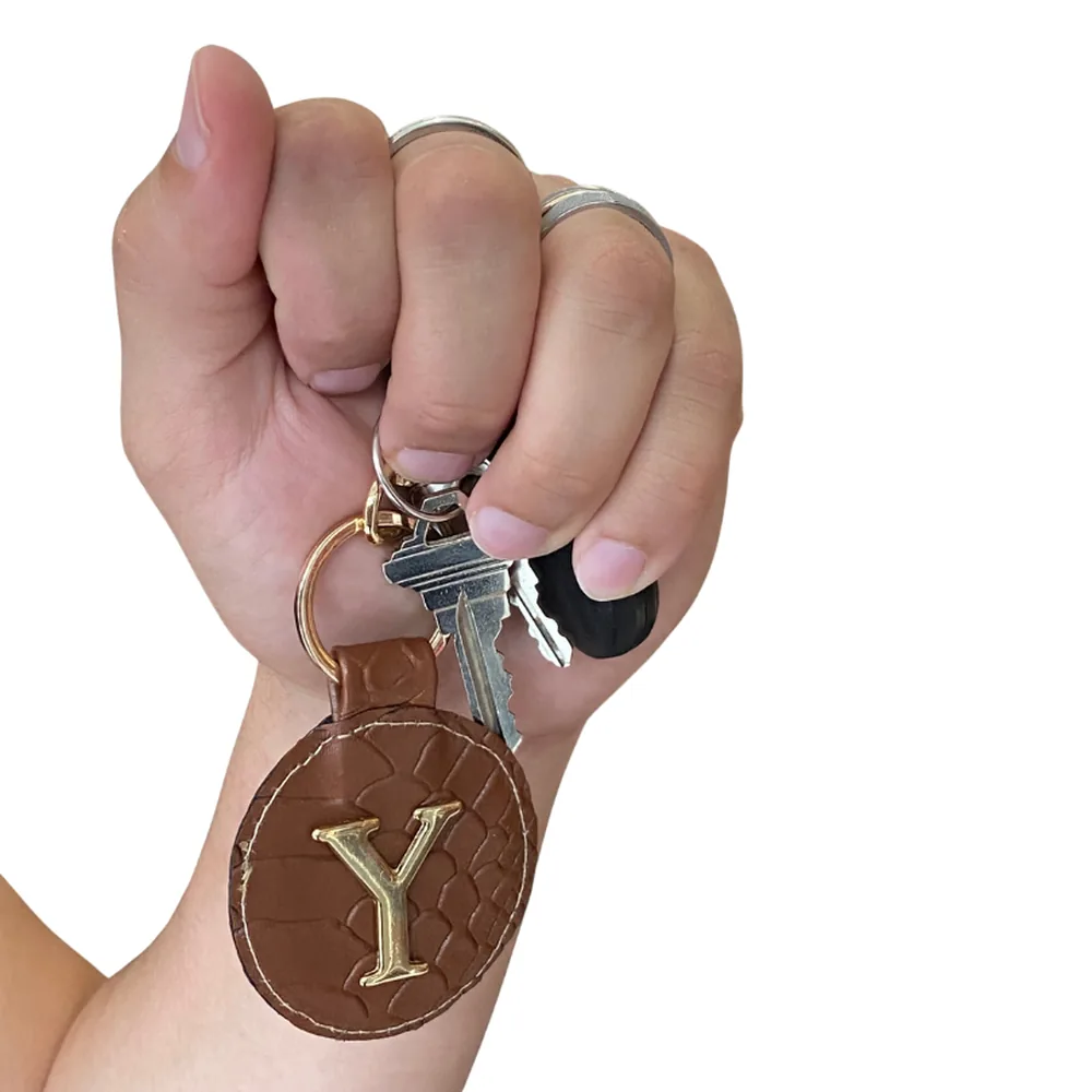 LLaveros circulares — bolsa personalizada con letras metálicas